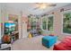 Cozy sun room with large windows, neutral carpet, and plenty of natural light at 314 Savannah Pl, Loganville, GA 30052