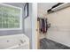 Bathroom includes a jetted tub, walk-in closet, and an exterior view through the window at 47 Glen Ridge Dr, Villa Rica, GA 30180