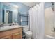 Cozy bathroom with a single sink vanity, toilet, and shower/tub combination with modern finishes at 47 Glen Ridge Dr, Villa Rica, GA 30180
