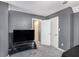 Bedroom featuring a large black TV, neutral walls, and a variety of closets at 47 Glen Ridge Dr, Villa Rica, GA 30180