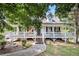 Charming home with inviting front porch, white railings, and a well-manicured yard at 47 Glen Ridge Dr, Villa Rica, GA 30180