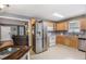 Open kitchen area featuring stainless appliances and hardwood floors adjacent to the living room at 47 Glen Ridge Dr, Villa Rica, GA 30180