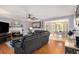 Cozy living room featuring a fireplace, hardwood floors, and comfortable seating at 47 Glen Ridge Dr, Villa Rica, GA 30180