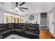 Spacious living room with hardwood floors, a large sectional sofa, and neutral wall colors at 47 Glen Ridge Dr, Villa Rica, GA 30180