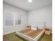 Bedroom featuring a large window and minimalist decor at 5217 Riden Ct # 263, Buford, GA 30518