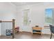 Bright entryway featuring hardwood floors, staircase, and natural light from the window at 5217 Riden Ct # 263, Buford, GA 30518