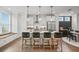 Bright kitchen with a central island, modern lighting, and an adjacent dining area at 5217 Riden Ct # 263, Buford, GA 30518
