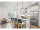 Beautiful kitchen featuring a large island, modern appliances, and stylish pendant lighting at 5217 Riden Ct # 263, Buford, GA 30518