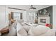 Bright living room featuring a large sectional sofa, fireplace, and views from the many windows at 5217 Riden Ct # 263, Buford, GA 30518