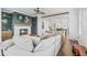 Bright living room featuring a large sectional sofa, fireplace, and views from the many windows at 5217 Riden Ct # 263, Buford, GA 30518