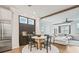 Open-concept living space combining a dining area, stainless fridge, and comfortable seating area at 5217 Riden Ct # 263, Buford, GA 30518