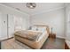 Comfortable main bedroom featuring a large bed, natural light, and neutral tones for a relaxing ambiance at 5217 Riden Ct # 263, Buford, GA 30518