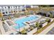 Stunning aerial view of a modern community pool with lounge chairs and gathering spaces at 5217 Riden Ct # 263, Buford, GA 30518