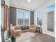 Cozy sitting room with unique decor, two plush chairs, and natural light, perfect for relaxation at 5217 Riden Ct # 263, Buford, GA 30518
