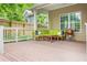 Relaxing back porch with comfortable seating, a grill, and a painted wood deck offers ideal outdoor living at 747 Dill Sw Ave, Atlanta, GA 30310