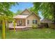 Charming backyard with lush lawn, mature trees, and wooden deck at 747 Dill Sw Ave, Atlanta, GA 30310