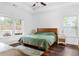 Bright bedroom features large windows, dark wood floors, and tray ceiling at 747 Dill Sw Ave, Atlanta, GA 30310