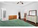 This bedroom boasts a walk-in closet, hardwood floors, and white trim at 747 Dill Sw Ave, Atlanta, GA 30310