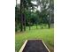 Scenic disc golf course featuring a wooded area and clear grass fairway at 747 Dill Sw Ave, Atlanta, GA 30310