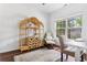 Bright office boasts hardwood floors, neutral walls and a chair and desk at 747 Dill Sw Ave, Atlanta, GA 30310