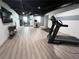 Finished basement with workout equipment, dark ceiling and light gray walls at 128 Golden Hills Dr, Woodstock, GA 30189
