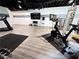 Finished basement has a Peloton exercise bike and various workout equipment at 128 Golden Hills Dr, Woodstock, GA 30189