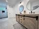 Modern bathroom with double sink vanity, hexagon tile floors, and a glass-enclosed shower at 128 Golden Hills Dr, Woodstock, GA 30189