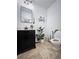 Charming bathroom featuring a modern vanity, stylish mirror, and decorative bicycle accent at 128 Golden Hills Dr, Woodstock, GA 30189