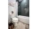Cozy bathroom featuring a bathtub with shower, and gray subway tile at 128 Golden Hills Dr, Woodstock, GA 30189