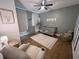 Bedroom with hardwood floors, a crib, and a comfortable chair at 128 Golden Hills Dr, Woodstock, GA 30189