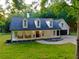 Inviting two-story residence with a large front porch and picturesque curb appeal at 128 Golden Hills Dr, Woodstock, GA 30189