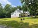 Charming two-story house with a welcoming front porch and well-manicured lawn at 128 Golden Hills Dr, Woodstock, GA 30189