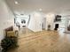 Spacious living room featuring hardwood floors, a fireplace, and ample natural light at 128 Golden Hills Dr, Woodstock, GA 30189