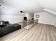 Spacious living room with modern flooring, comfortable seating, and an open staircase at 128 Golden Hills Dr, Woodstock, GA 30189