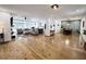 Open-concept living space with hardwood floors, neutral decor, and abundant natural light at 128 Golden Hills Dr, Woodstock, GA 30189
