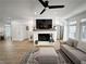 Living room featuring a fireplace, hardwood floors, and an inviting, cozy atmosphere at 128 Golden Hills Dr, Woodstock, GA 30189