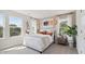 Serene bedroom with lots of light, simple accents and natural wood nightstand at 1305 Lakota Pl, Atlanta, GA 30315
