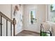 Entryway featuring a modern door with glass panels, allowing natural light to fill the space and highlight wood floors at 1305 Lakota Pl, Atlanta, GA 30315