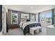 Spacious main bedroom showcasing an ample bed, a large window providing natural light, and soothing neutral tones at 1305 Lakota Pl, Atlanta, GA 30315