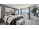 Spacious main bedroom showcasing an ample bed, a large window providing natural light, and soothing neutral tones at 1305 Lakota Pl, Atlanta, GA 30315