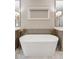 Modern bathroom with a freestanding tub, elegant fixtures, and marble flooring creating a serene oasis at 2110 Timball Nw Rd, Atlanta, GA 30318