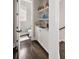 Small guest bathroom with vanity, cabinet, and small crystal chandelier lighting at 2110 Timball Nw Rd, Atlanta, GA 30318
