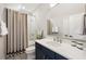 Bathroom showcasing modern sink, tiled flooring, and shower with glass enclosure at 2110 Timball Nw Rd, Atlanta, GA 30318