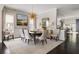 Elegant dining room with hardwood floors, designer lighting and stylish decor at 2110 Timball Nw Rd, Atlanta, GA 30318