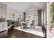 Inviting dining room with vaulted ceiling, hardwood floors, and backyard access at 2110 Timball Nw Rd, Atlanta, GA 30318