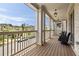 Spacious front porch with comfortable seating and neighborhood views at 2110 Timball Nw Rd, Atlanta, GA 30318