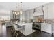 Full kitchen features stainless steel range, a central island with seating, and custom cabinets at 2110 Timball Nw Rd, Atlanta, GA 30318