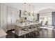 Spacious kitchen features an island with seating and modern pendant lights in a well-lit open space at 2110 Timball Nw Rd, Atlanta, GA 30318