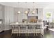Bright kitchen with granite countertops, central island seating, and herringbone backsplash, complemented by pendant lights at 2110 Timball Nw Rd, Atlanta, GA 30318