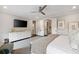 Open and airy main bedroom showcases ample space, walk-in closet, and an entertainment center at 2110 Timball Nw Rd, Atlanta, GA 30318